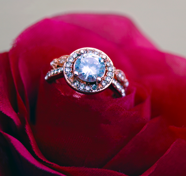 Diamond ring placed on flower