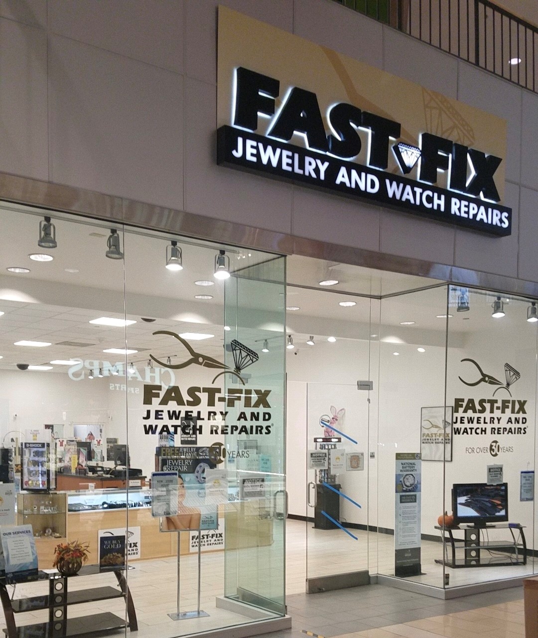 All glass store front with Fast-Fix sign on top. 